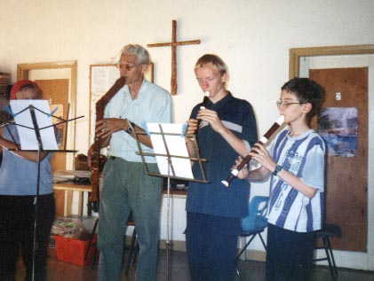 Daniel and Tim playing recorders with a friend
