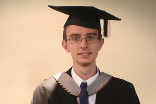 Tim in his official rental gown and mortarboard