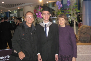 Tim with his proud parents after graduation