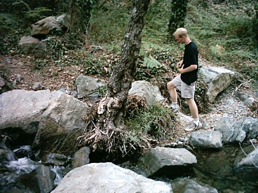 Daniel by a stream in Troodos, where we went for a few cooler days in the summer