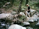 Daniel stepping over a stream in the Troodos mountains
