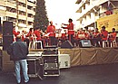The town band plays Christmas carols