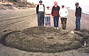 The proud builders of a sandcastle at Kiti Beach, March 2001