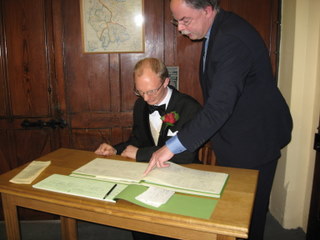 Daniel signing the register