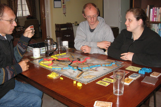 Daniel and Becky playing a Catan game in Cyprus