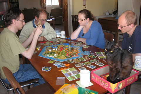 Family game of Settlers of Catan