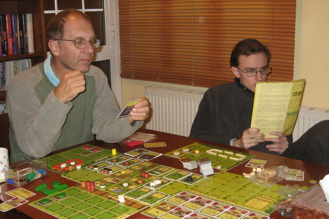 Richard and Tim learning to play the game Agricola