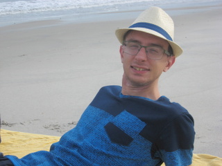 Tim on a beach in Panama in his Panama hat
