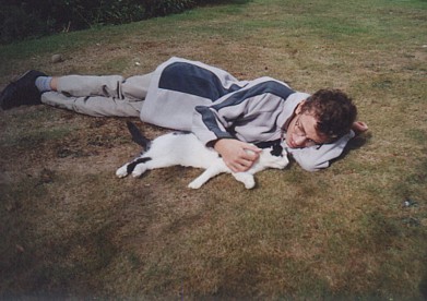 Tim with the neighbours' cat Rosie in the UK