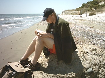 Dan, reading at Kiti beach