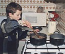 Tim does some cooking in our Cyprus kitchen